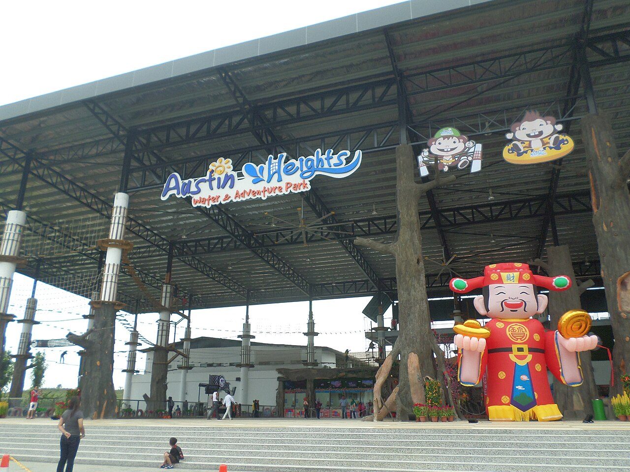 The covered entrance plaza of Austin Heights Water and Adventure Park in Johor Bahru, with a ropes course under the roof