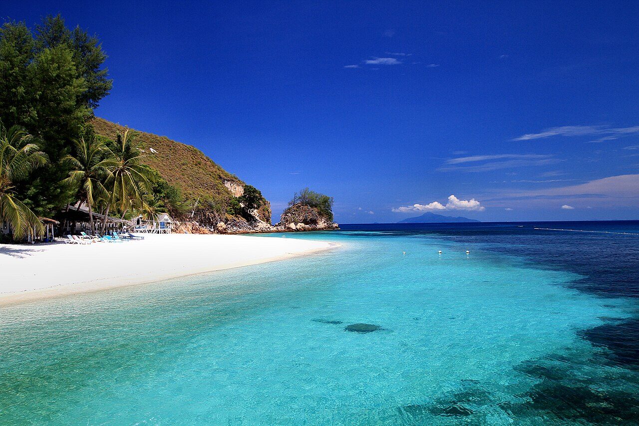 Johor Bahru beaches and islands: white sand, palms and clear turquoise water at Pulau Rawa, off Mersing