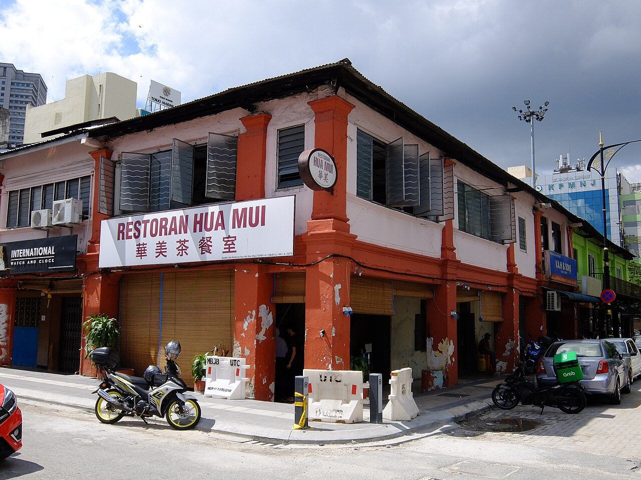 Corner shophouse of Restoran Hua Mui on Jalan Trus with its red and white signboard, an old-town stop for Johor Bahru hawker food, photographed in 2020