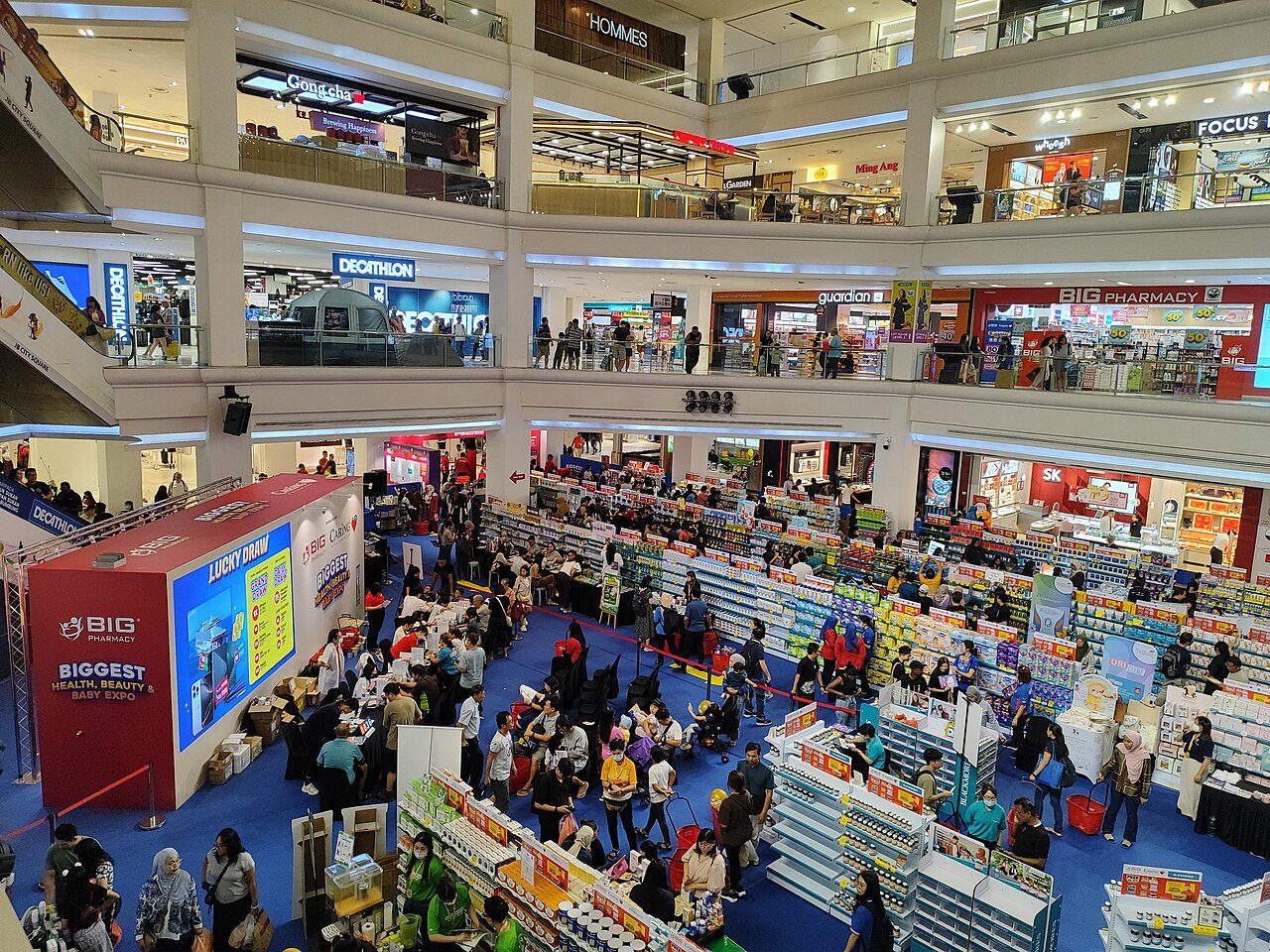 The atrium of Johor Bahru City Square, one of the shopping malls in Johor Bahru, with a sale on the ground floor and shopfronts on the levels above