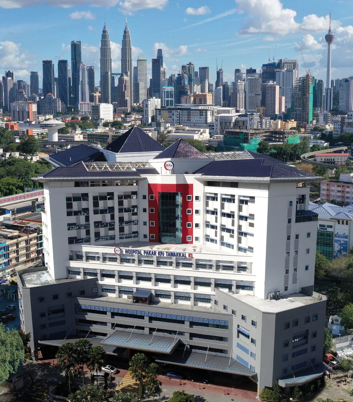 Aerial view of KPJ Tawakkal KL Specialist Hospital on Jalan Pahang Barat with the KL skyline behind