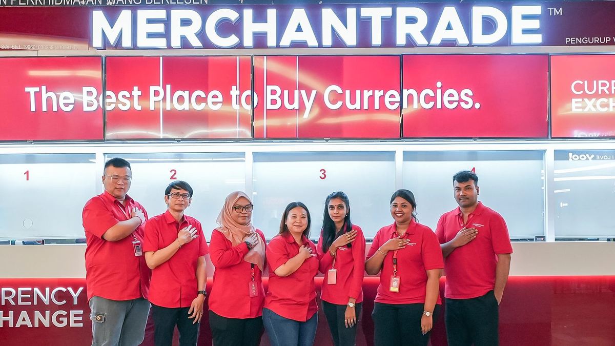 Staff at the Merchantrade currency exchange counter in Mid Valley Megamall, one of the money changers in Kuala Lumpur