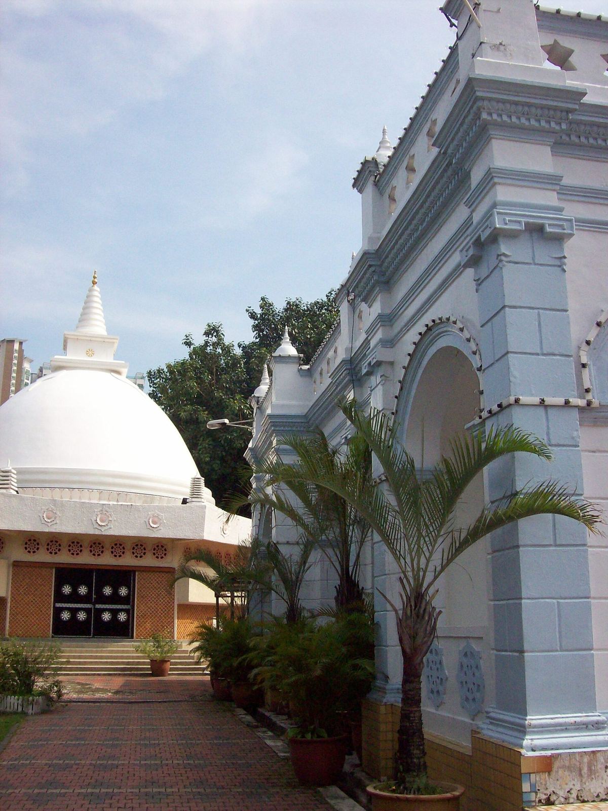 White stupa and shrine hall of the Buddhist Maha Vihara temple in Brickfields, Kuala Lumpur