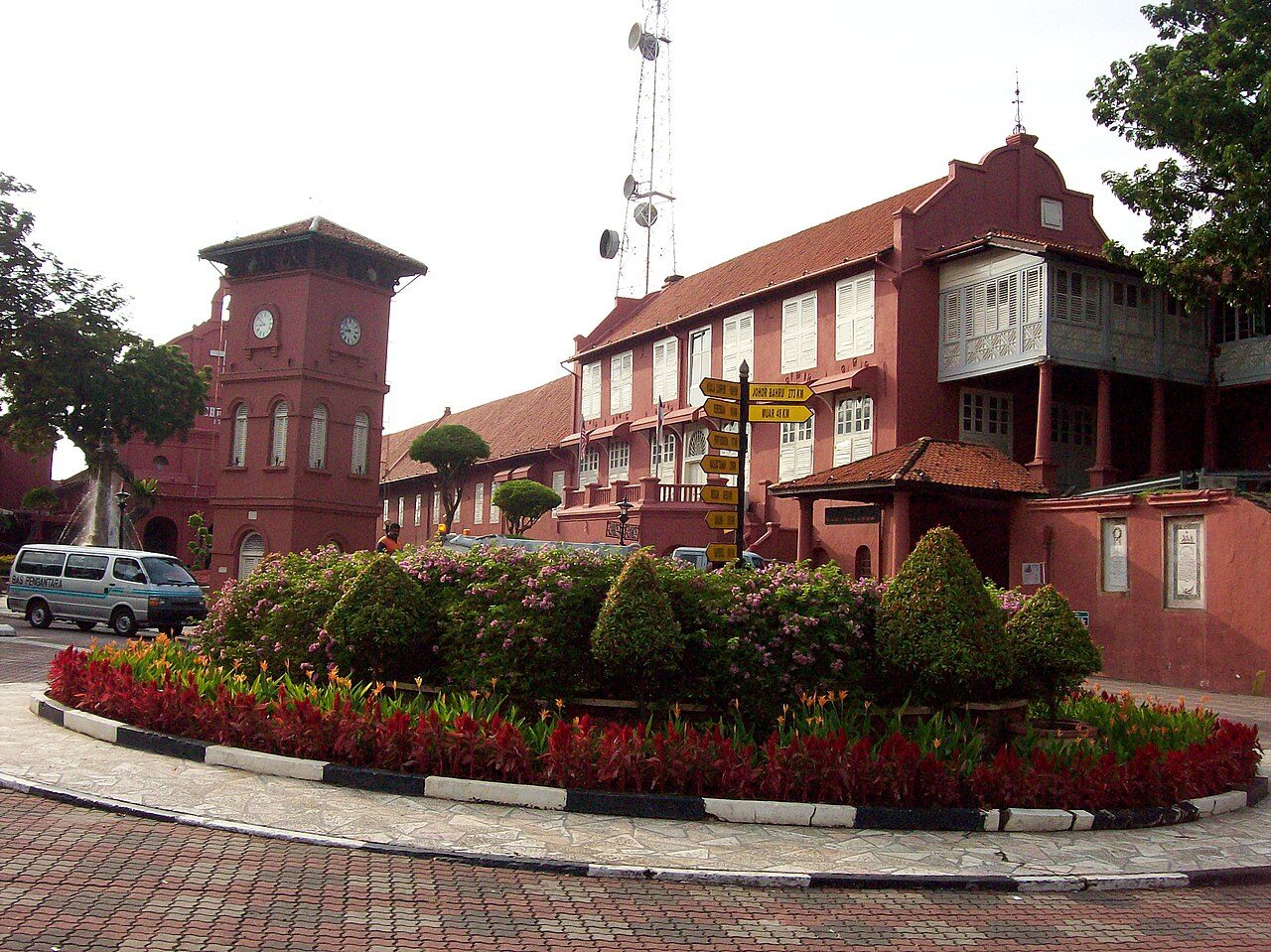 Melaka attractions: the red Stadthuys and its clock tower in Dutch Square, the centre of the old town