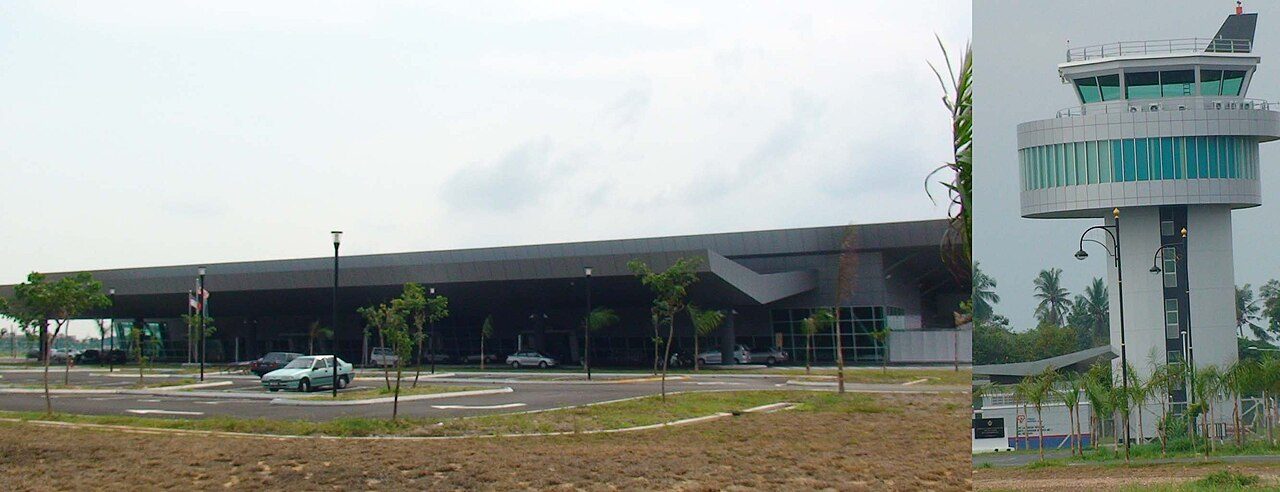 The low terminal building and car park of Melaka International Airport at Batu Berendam, with the control tower beside it