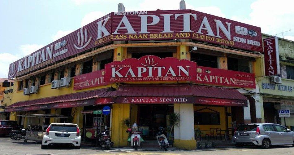 槟城乔治市 Lebuh Chulia 与 Lebuh Pitt 转角挂着红色招牌的 Restoran Kapitan 店面