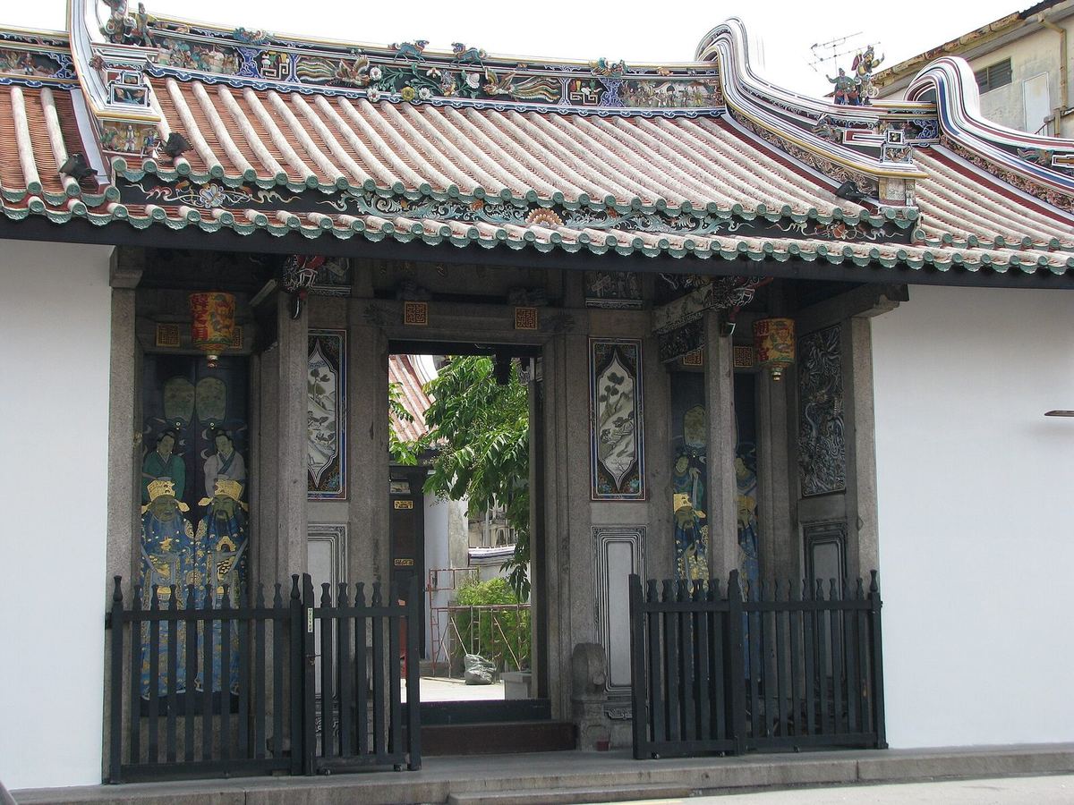 Carved entrance gate and painted door guardians of Han Jiang Teochew Ancestral Temple, Lebuh Chulia, Penang