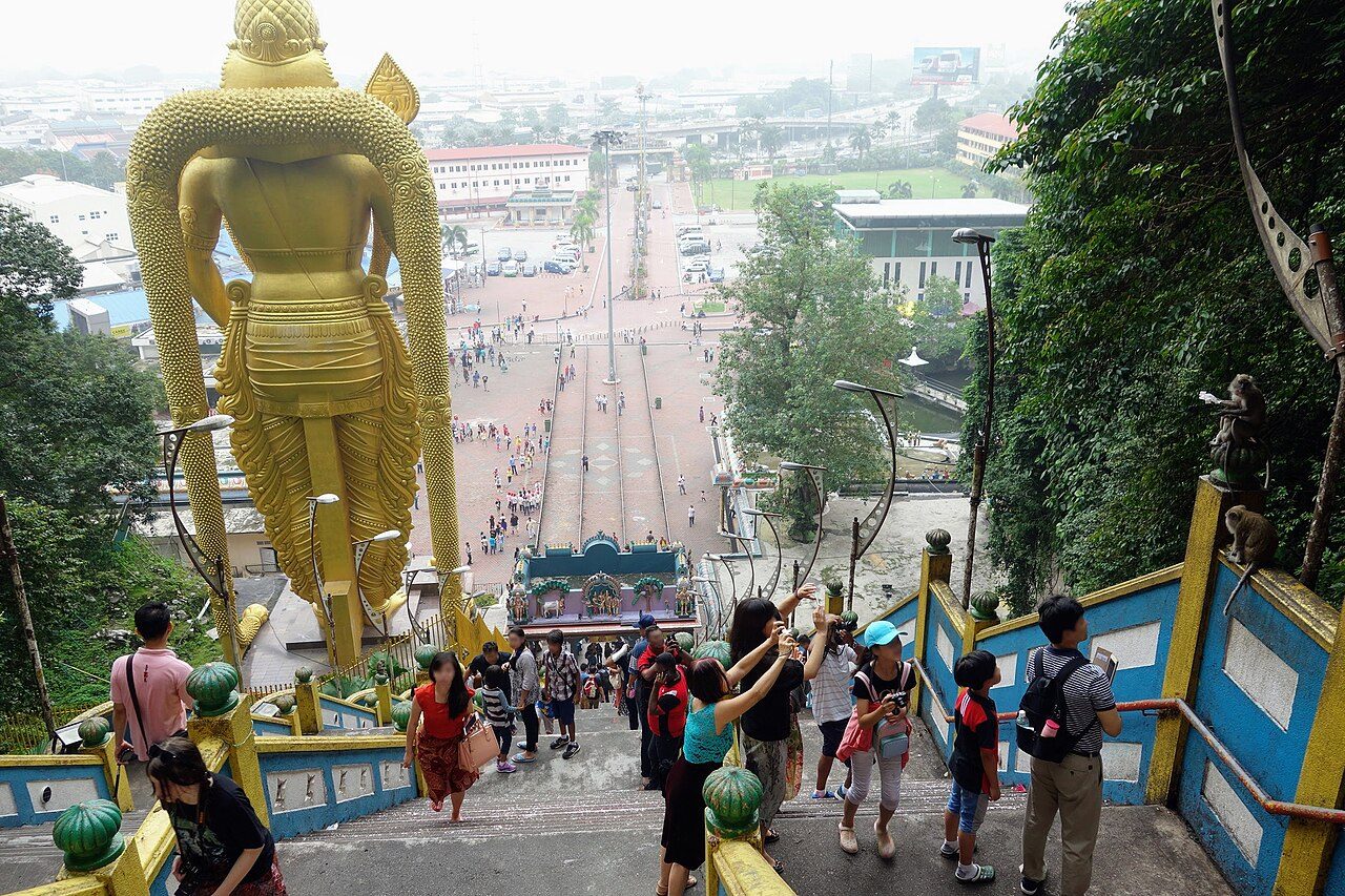 Selangor attractions: the Lord Murugan statue and plaza at Batu Caves seen from the temple stairs, one of the things to do in Selangor