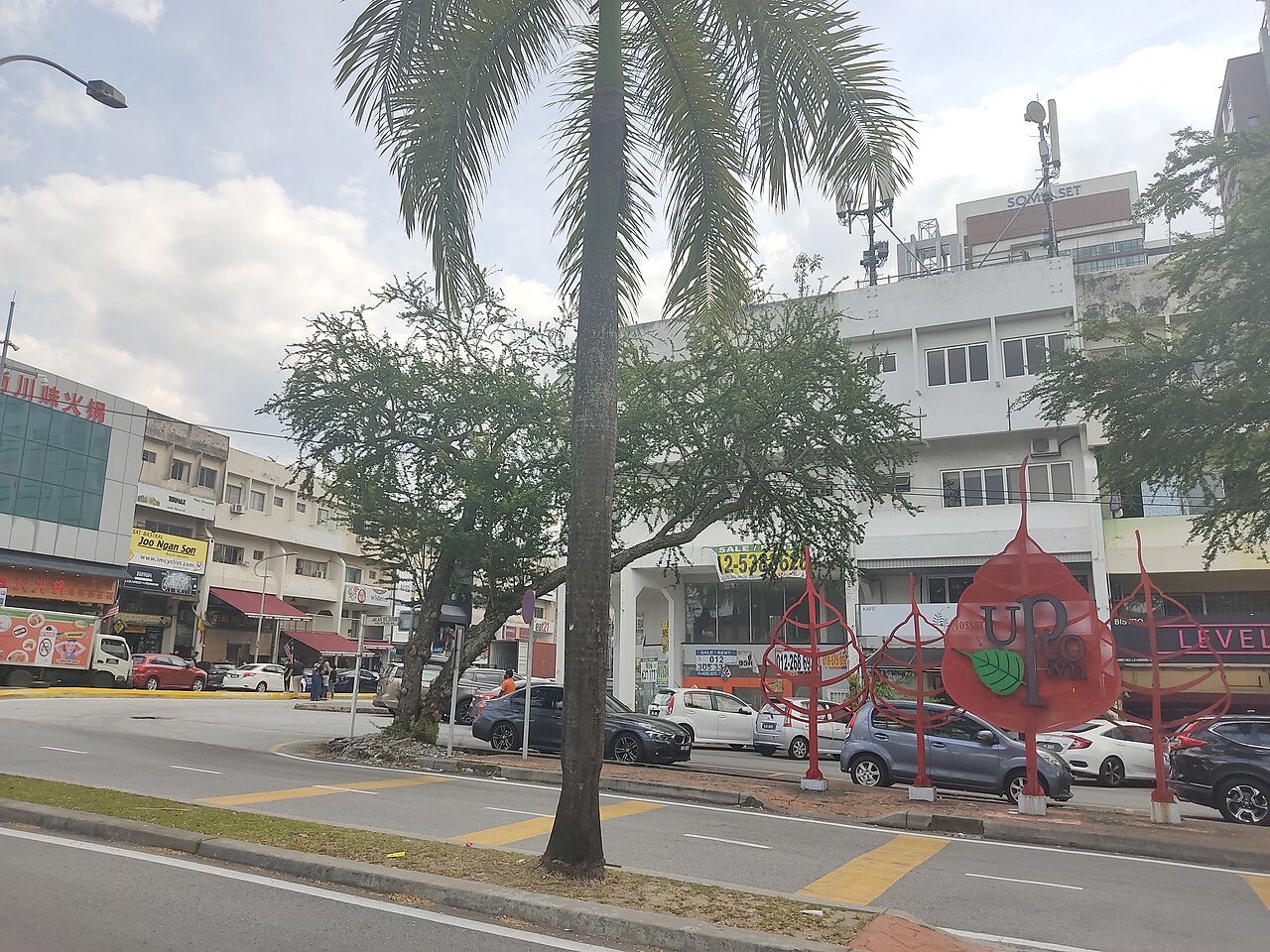 Selangor bars guide: the red Uptown sign and shop-office blocks at Damansara Uptown, Petaling Jaya, by day