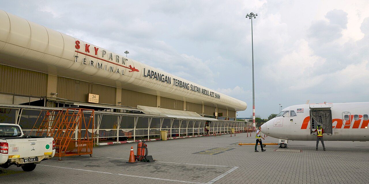 The SkyPark Terminal at Subang Airport seen from the apron, with a turboprop aircraft parked alongside