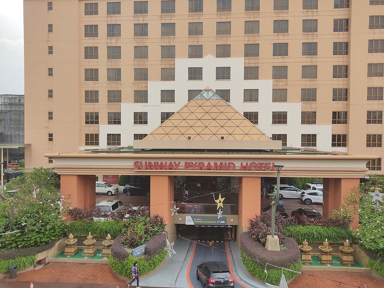 Sunway Pyramid Hotel entrance with its name sign and a small pyramid roof below the hotel block