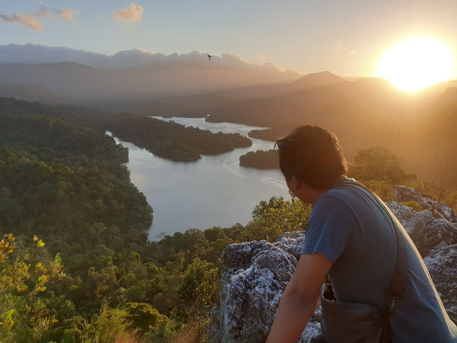 Hiker on the rocky Bukit Tabur ridge in Gombak at sunset, one of the nature and outdoors spots in Selangor covered in this guide