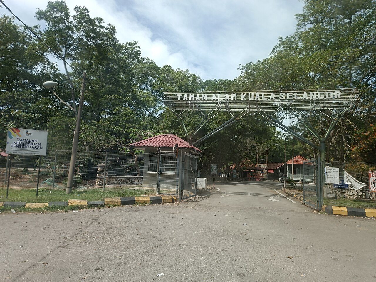 Taman Alam Kuala Selangor entrance gate with its name sign over the access road, Kuala Selangor Nature Park