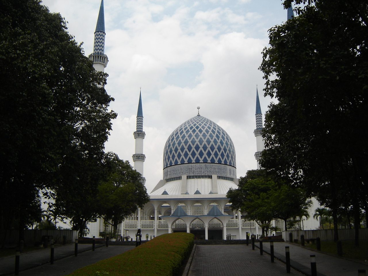 The blue dome and minarets of the Sultan Salahuddin Abdul Aziz Shah Mosque in Shah Alam
