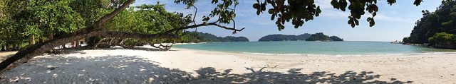 Panoramic view of white sand and green islands at Coral Bay, Pangkor Island