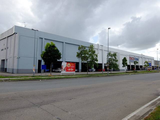 The long grey hypermarket building at Mutiara Rini in 2020, then signed Tesco Extra, seen from the road