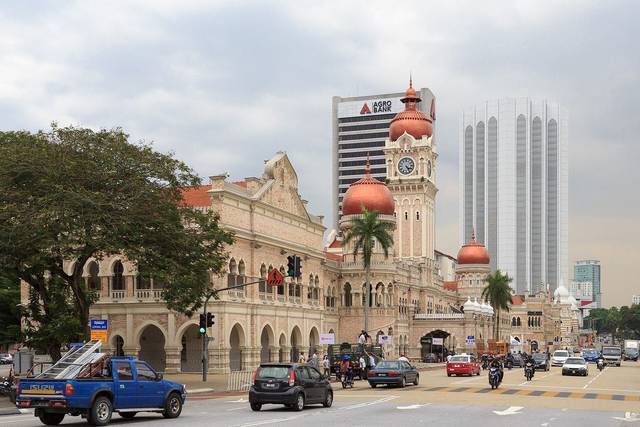 Clock tower and copper domes of the Sultan Abdul Samad Building on Jalan Raja, Kuala Lumpur