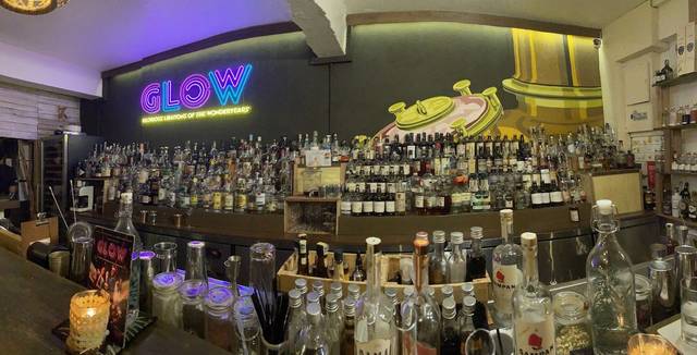 Back bar with bottles and neon sign at JungleBird, Plaza Damansara, Bukit Damansara, Kuala Lumpur