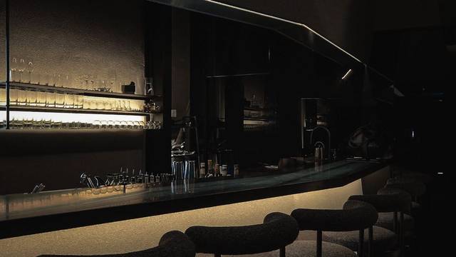Dimly lit bar counter inside Penrose cocktail bar on Jalan Petaling, Chinatown, Kuala Lumpur