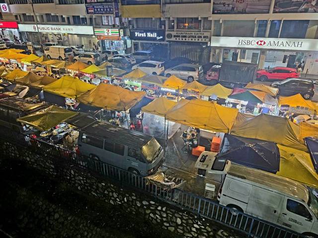 Rows of yellow-canopied stalls at Taman Connaught Night Market, Jalan Cerdas, Cheras, Kuala Lumpur