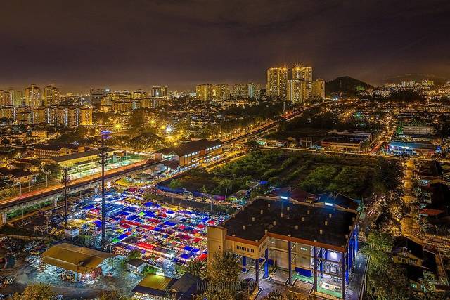 Pasar malam canopies beside the LRT, one of the night markets in Kuala Lumpur