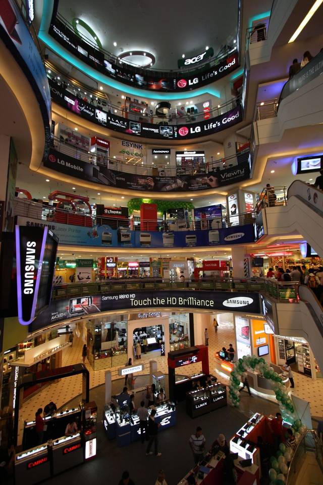 Atrium of Plaza Low Yat in Bukit Bintang, lined with phone and gadget shops, the centre of phone repair in Kuala Lumpur