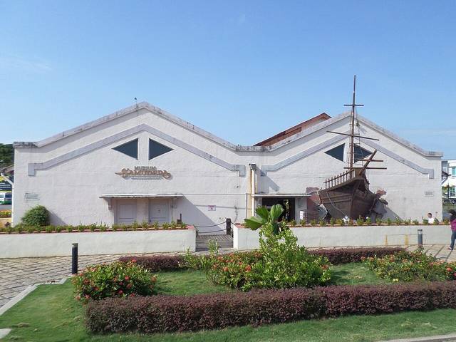 The Maritime Museum in Melaka with the wooden replica ship Flor de la Mar beside the white gallery building