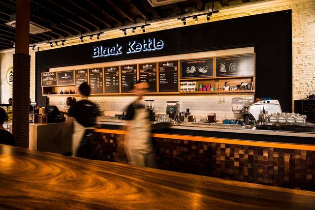 Coffee and order counter under the Black Kettle sign inside the cafe on Beach Street, George Town, Penang
