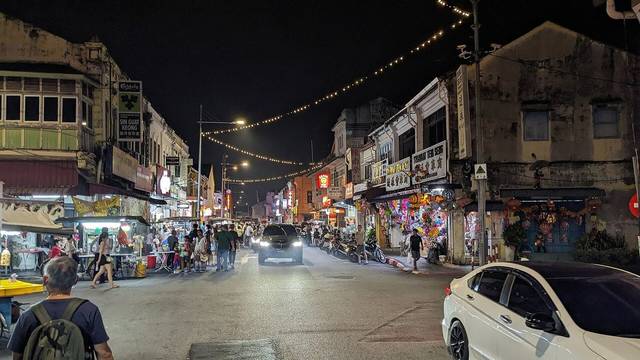 Hawker stalls and heritage shophouses at night on Lebuh Kimberley, George Town, Penang