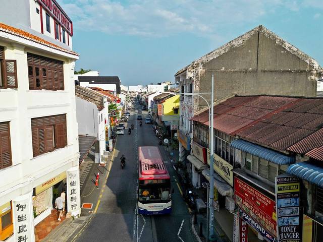 Chulia Street, George Town, with money changer signboards on the right, where many money changers in Penang trade